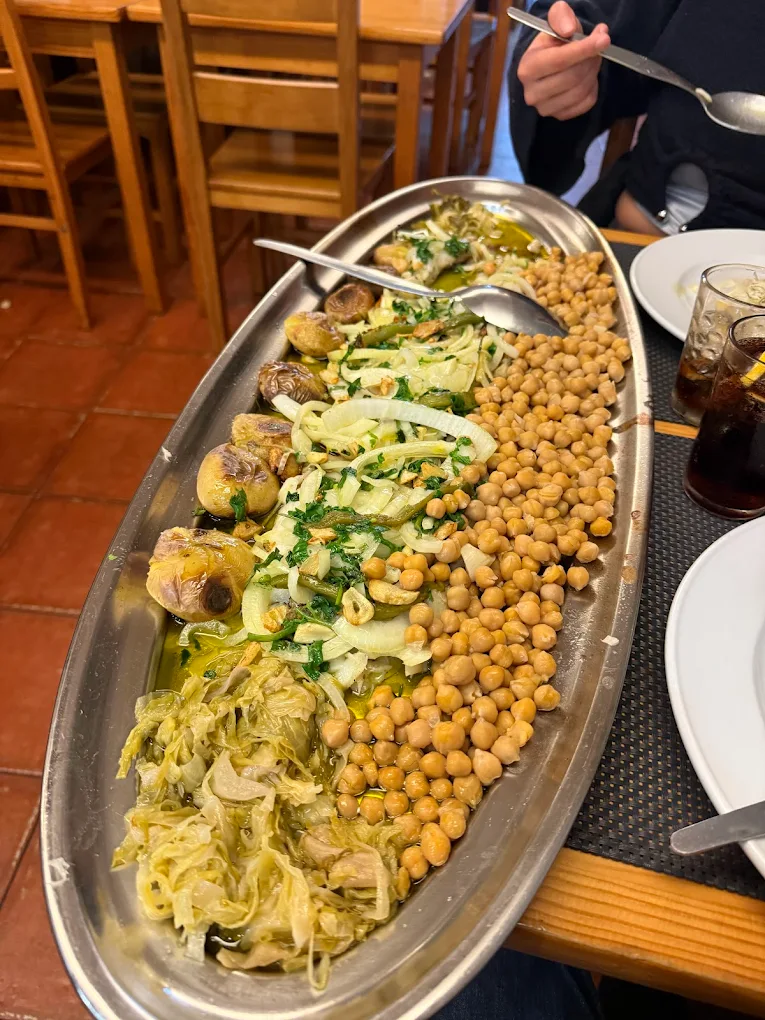 Platter of grilled fish, chickpeas and vegetables